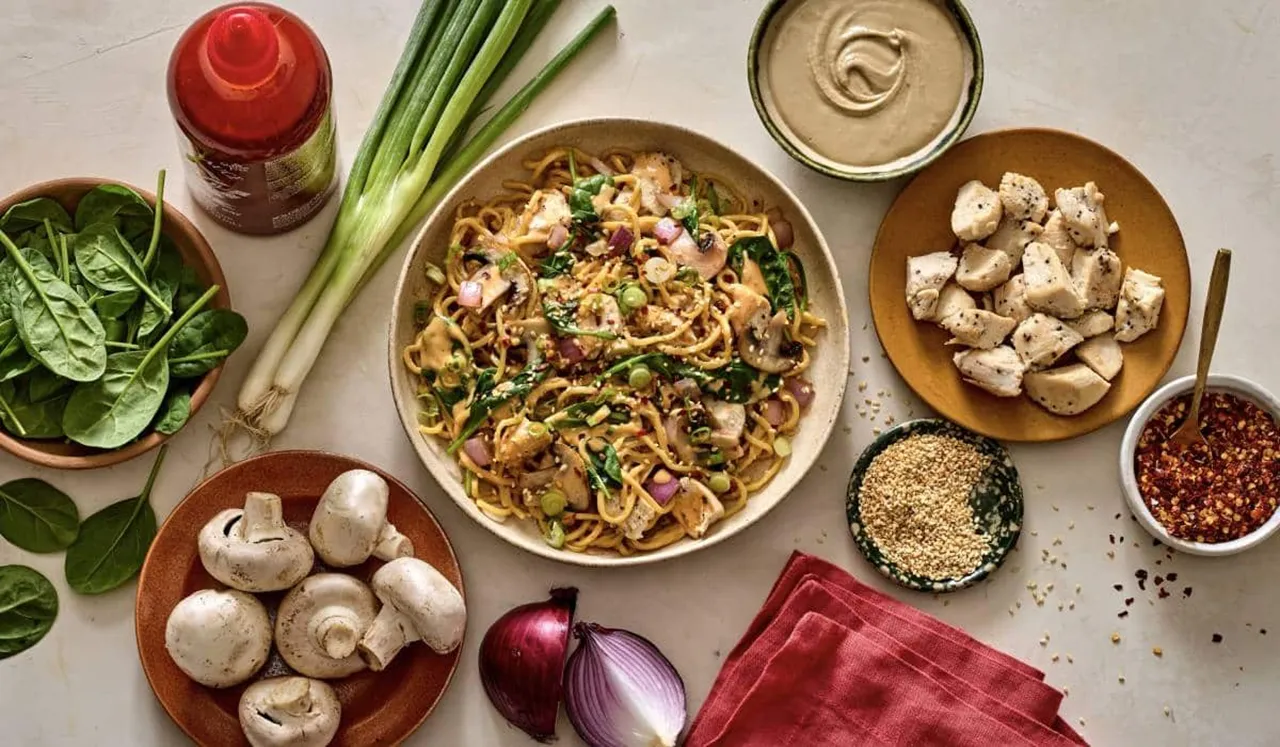 A close-up shot of a fast-casual stir-fry dish from Honeygrow, demonstrating how chili crisp can be optionally added to customize and enhance the umami restaurant menu flavor profile