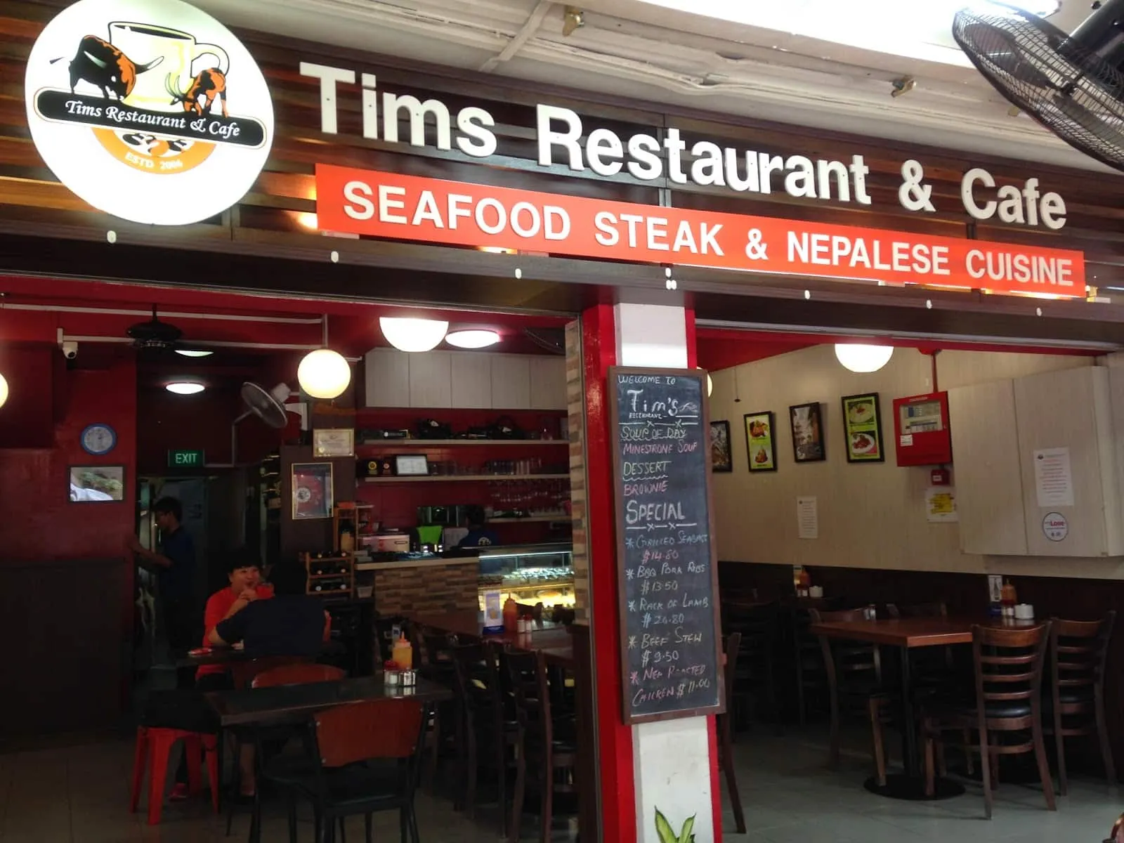 Tims Restaurant & Cafe interior and menu display in Singapore
